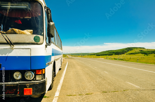 intercity bus on the side of the road in russia photo