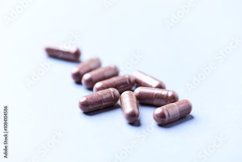 Lutein capsules. Dietary supplement on bright background. Soft focus. Close up. Copy space 