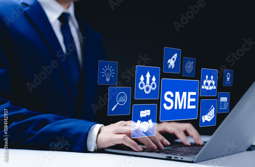 SME Business Growth and Success Concept. Businessman typing on a laptop with digital icons representing small and medium-sized enterprises, innovation, and growth strategies. SMEs, Startup company, photo