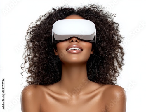 Young woman with curly hair experiences virtual reality technology in a brigh...