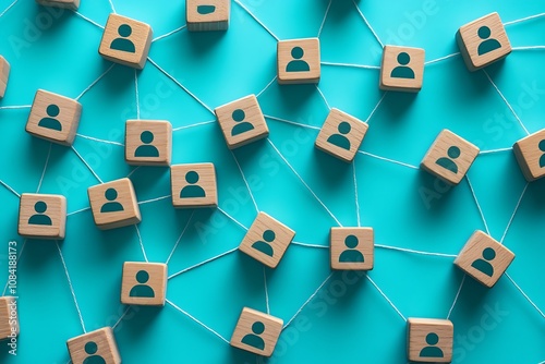 Interconnected Wooden Blocks with Person Symbols on Blue Background photo