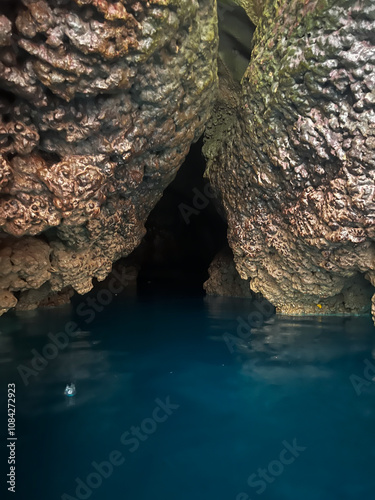 Enchanting Water Cave with Crystal Blue Reflections