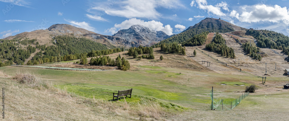 green slopes of Sises and Motta peaks with ski-lift systems, Sestriere, Italy