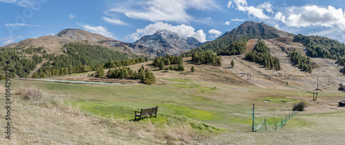 Obraz na płótnie green slopes of Sises and Motta peaks with ski-lift systems, Sestriere, Italy w salonie
