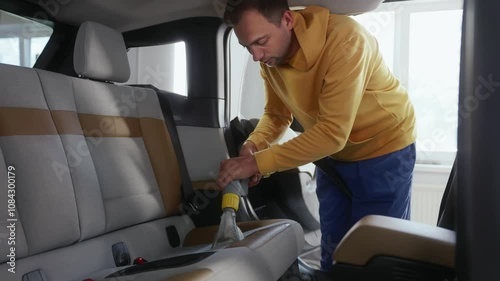 Cleaning car interior with washing vacuum cleaner
