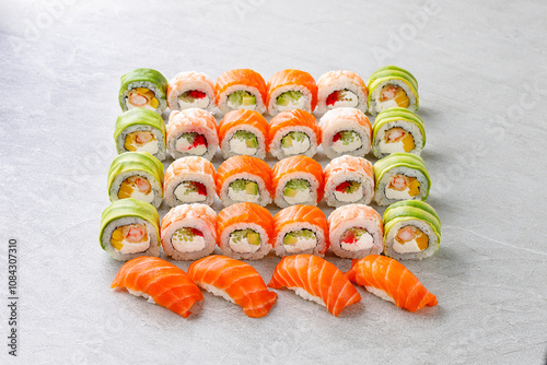 Japanese sushi rolls, sushi sets on a gray background for restaurant menu and food delivery