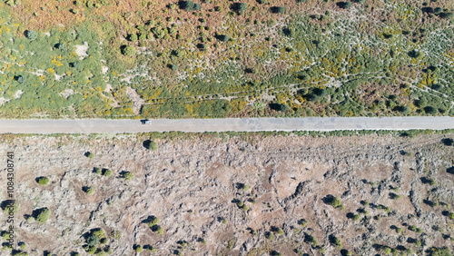 Top View of Car on Road Through Diverse Landscape