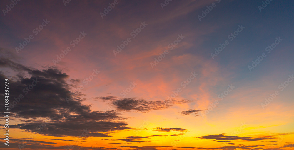 Fototapeta premium Morning cloud and sky background,Real majestic sunrise sundown sky background with gentle colorful clouds without birds. Panoramic, big size