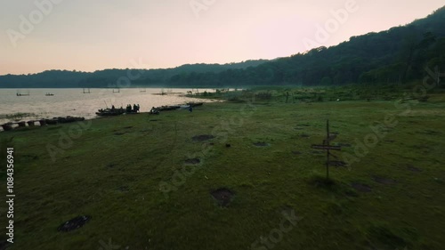 fpv drone aerial view morning  landscape with grass and fog in bali 