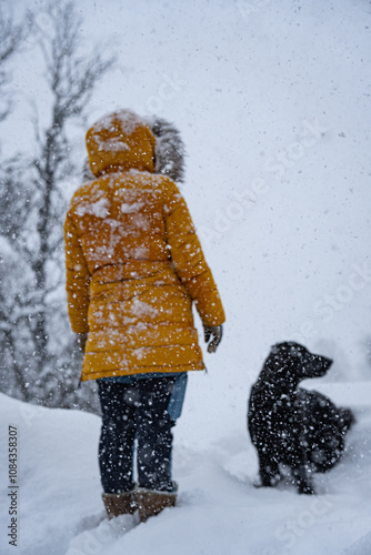 Dog and owner in snow