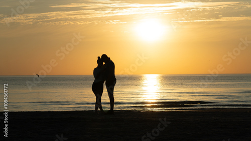 silhouette of a couple on the beach