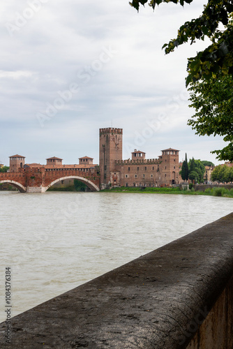 view to the Ponte Scaligero bridge at a cloudy day in Verona, Italy  photo