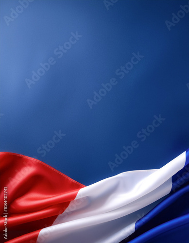 French flag waving in the wind on side position provides copy space for text isolated dark blue background