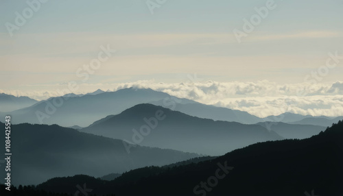 Layered Mountain Ranges: A majestic panorama of mountain ranges, bathed in the ethereal glow of a soft light, unfolds before your eyes. The layers of mountains.