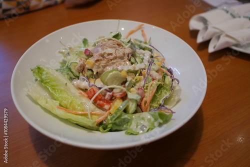 Fresh salad preparation restaurant kitchen food photography cozy atmosphere close-up healthy eating concept