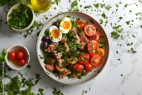 Mediterranean salad with tuna, boiled eggs, olives, and fresh tomatoes garnished with parsley. Healthy food photography.