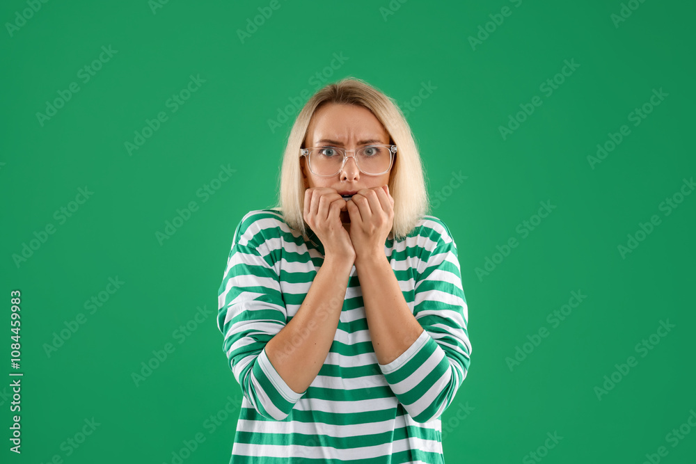 Portrait of scared woman on green background Portrait of scared woman on green background