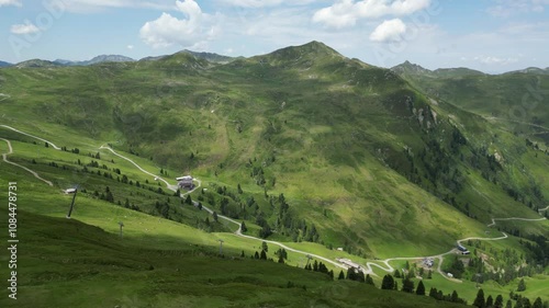 Aerial video of a valley in Austrian Alps, buildings and nature