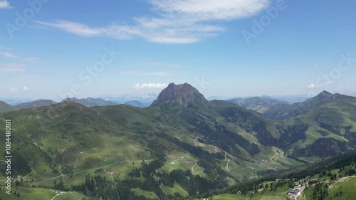 Aerial video of a valley in Austrian Alps, buildings and nature