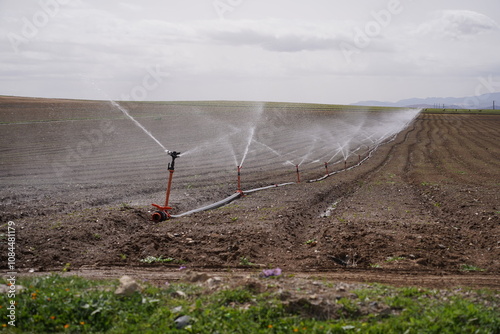 agricultural field with sprinklers