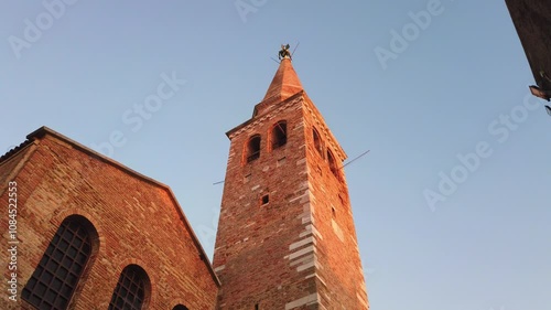 Exterior of early christian Basilica of Sant'Euphemia in Grado, Italy, at sunset