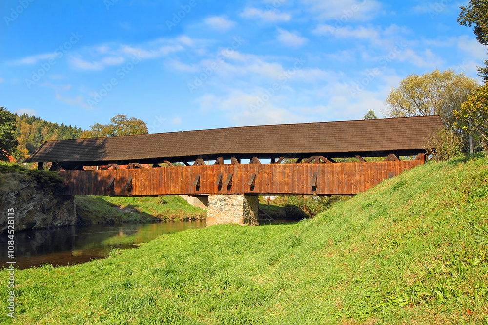 River Svratka and wooden covered bridge built in 1718. It is the oldest covered wooden bridge in Moravia, Cernvir Village, Highlands Region, Czech Republic
