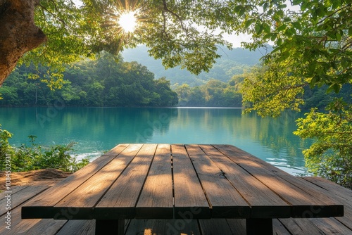 Serene lakeside setting with wooden picnic table amidst lush greenery in earl...