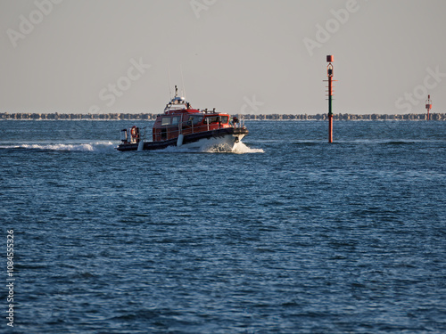 little fire fighter boat in the gulf of la spezia photo