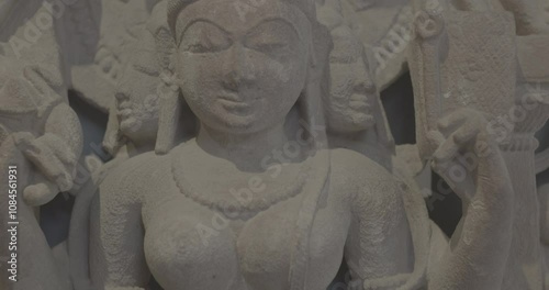 Close-up view on Ancient Stone Bas-relief Of Brahmani Or Brahmi, One Of Seven Hindu Mother Goddesses Known As Sapta Matrikas. Ungraded C LOG 2 She Is Aspect Of Adi Shakti, Possessing rajas Guna And Is photo