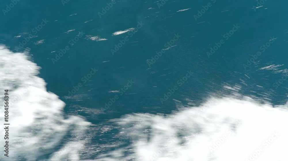 Waves moving on azure Red Sea. Blue water surface, foam bubbles. Travel, boat trips, summer holidays, tourism. Travel beach holidays. Waves moving on azure Red Sea. Blue water surface, foam bubbles. Travel, boat trips, summer holidays, tourism. Travel beach holidays.