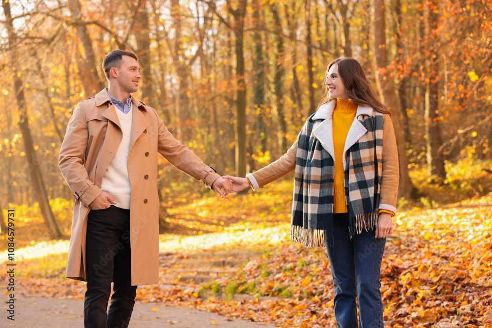Happy couple spending time together in autumn park Happy couple spending time together in autumn park