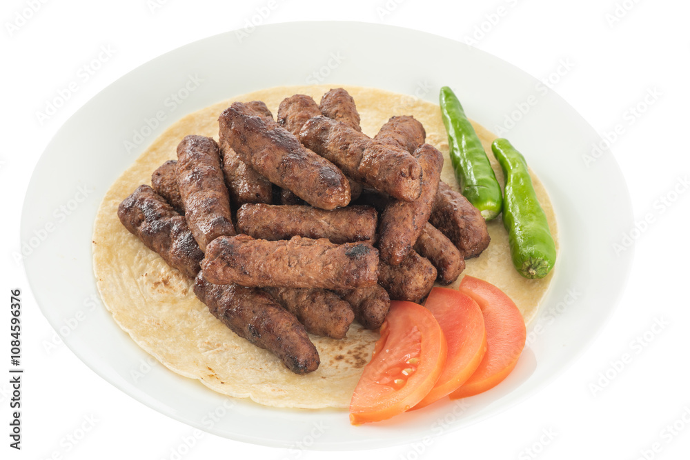 Turkish style meatballs on lavash, served with tomatoes and fresh peppers. Turkish style meatballs on lavash, served with tomatoes and fresh peppers.