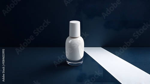 Elegantly Arranged White Nail Polish Bottle on a Black Surface with Contrasting Light for Stylish Nail Art Composition photo