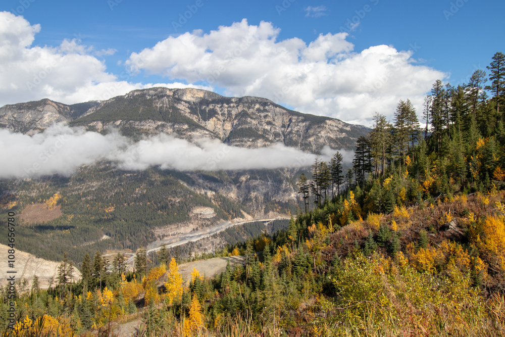 Fototapeta premium Highway in a valley in the Canadian Rocky Mountains