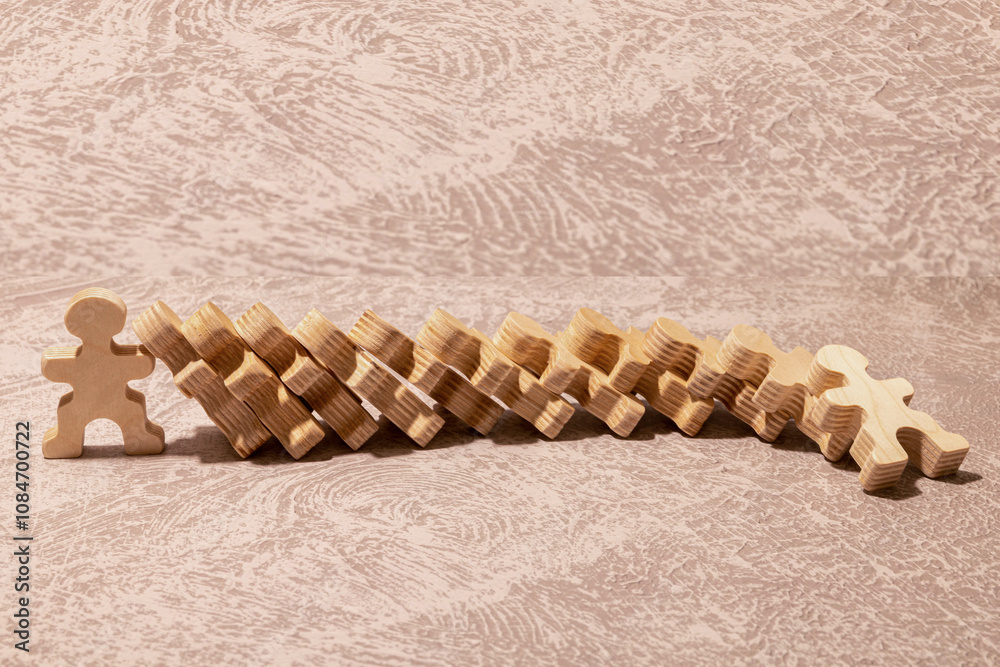 © Uladzislau - Domino effect in business. One businessman leader falls.