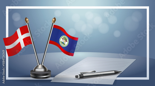 Denmark and Belize National flags on small table with bokeh background, cooperative relationship