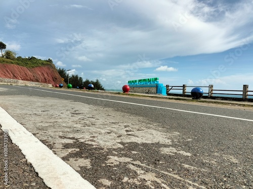 Asphalt road view on green mountain, beautiful natural blue sky background. High angle view.