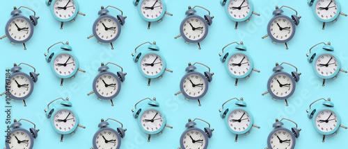 Alarm clocks on blue background photo