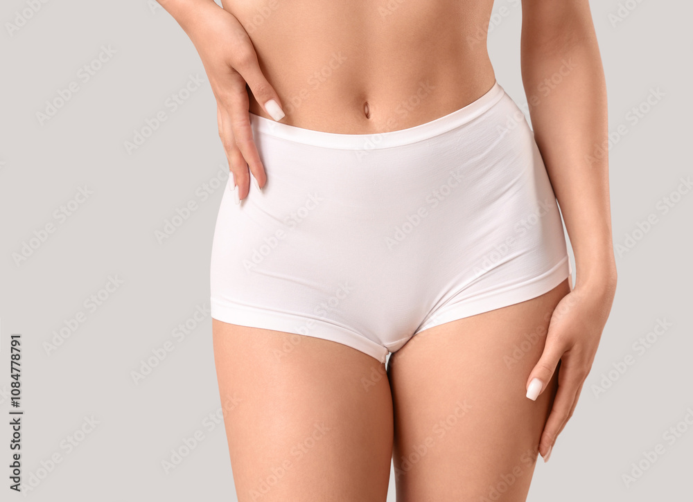 Pretty young woman in underwear on light background, closeup Pretty young woman in underwear on light background, closeup
