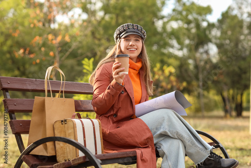 Female tourist with map and...