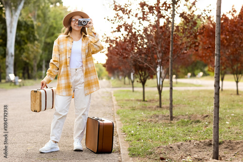 Female tourist with photo c...