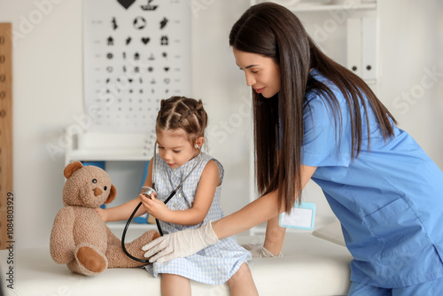 Female pediatrician and cut...