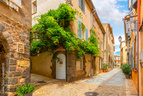 Wallpaper Mural A charming, picturesque street in the medieval village of Grimaud, France, in the hills above Saint-Tropez along the French Riviera.	 Torontodigital.ca