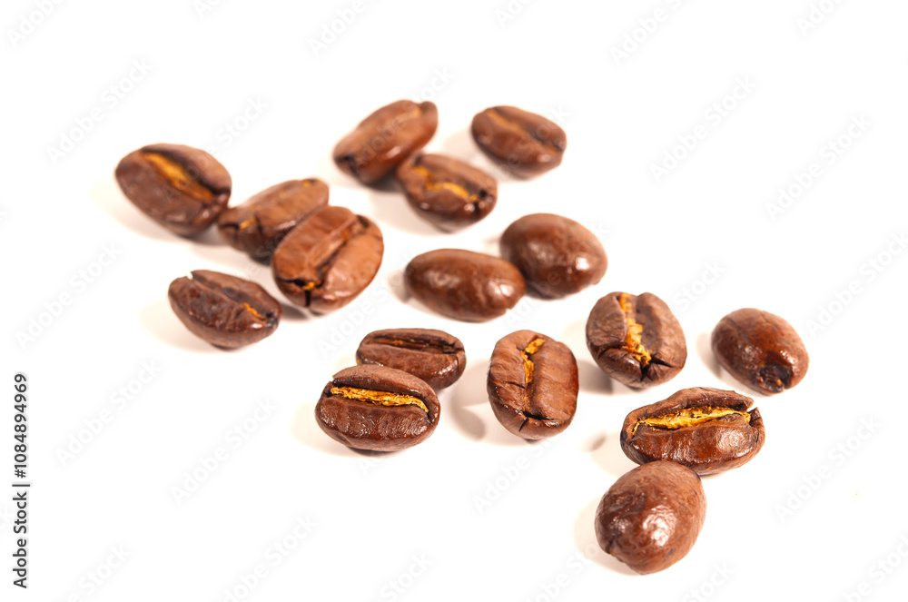 Naklejka premium Top view of brown roasted coffee beans isolated on white background, for background, illustration and pattern design.