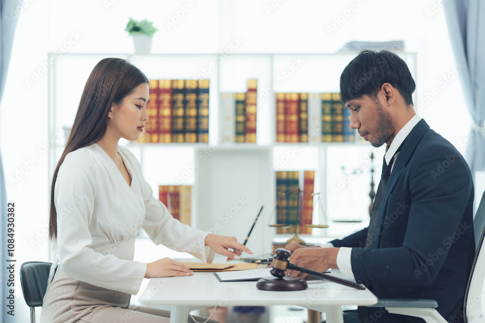 Legal Consultation: Focused Lawyers Reviewing Documents Legal Consultation: Focused Lawyers Reviewing Documents