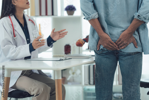 Doctor Consulting Patient with Lower Back Pain