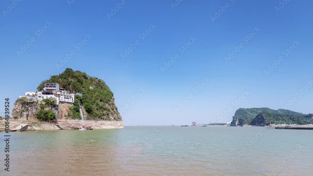 time lapse video of the Yangtze river landscape, small solitary mountain and busy water transport scene, Anhui province, China. time lapse video of the Yangtze river landscape, small solitary mountain and busy water transport scene, Anhui province, China.