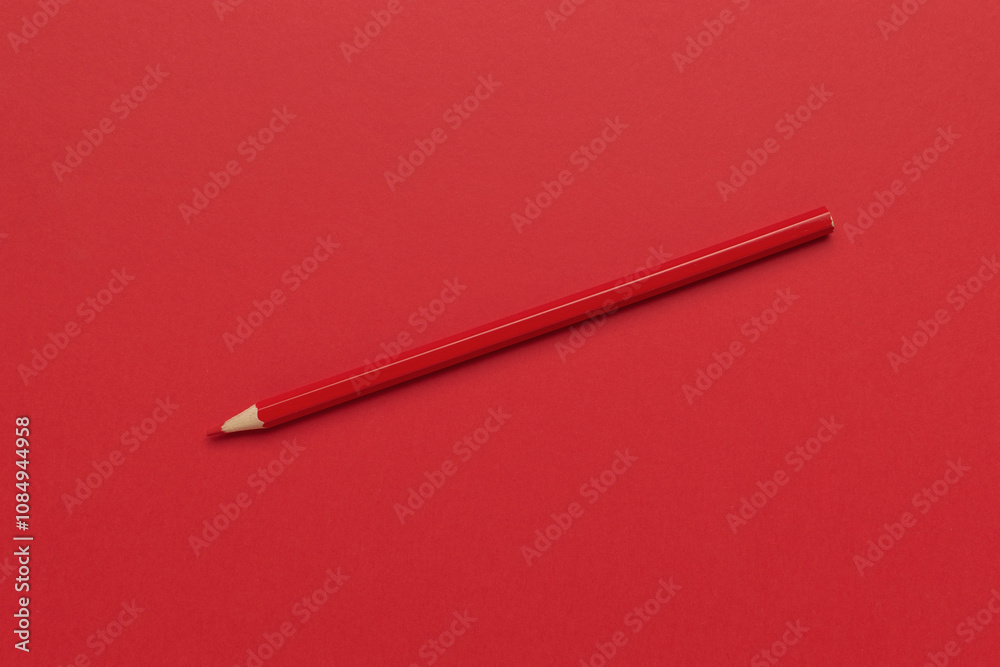 Minimalistic Red Pencil on Matching Solid Red Background Stock Photo Minimalistic Red Pencil on Matching Solid Red Background Stock Photo