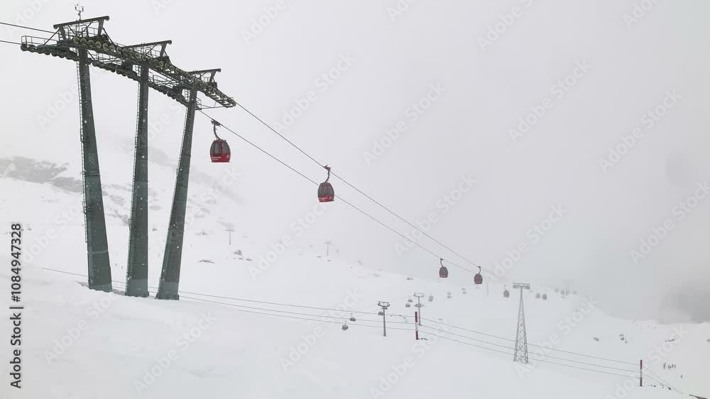 Cable Car Ascending Snowy Mountains with Stunning Scenic Views Cable Car Ascending Snowy Mountains with Stunning Scenic Views