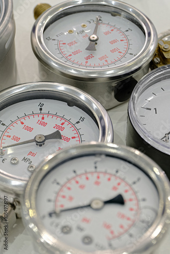 Several assorted pressure gauges photo